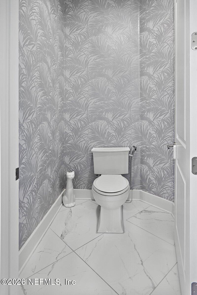 556 Timber Bridge Lane Atlantic Beach, FL 32233 - Photo 34 of 71 a white toilet sitting next to a shower