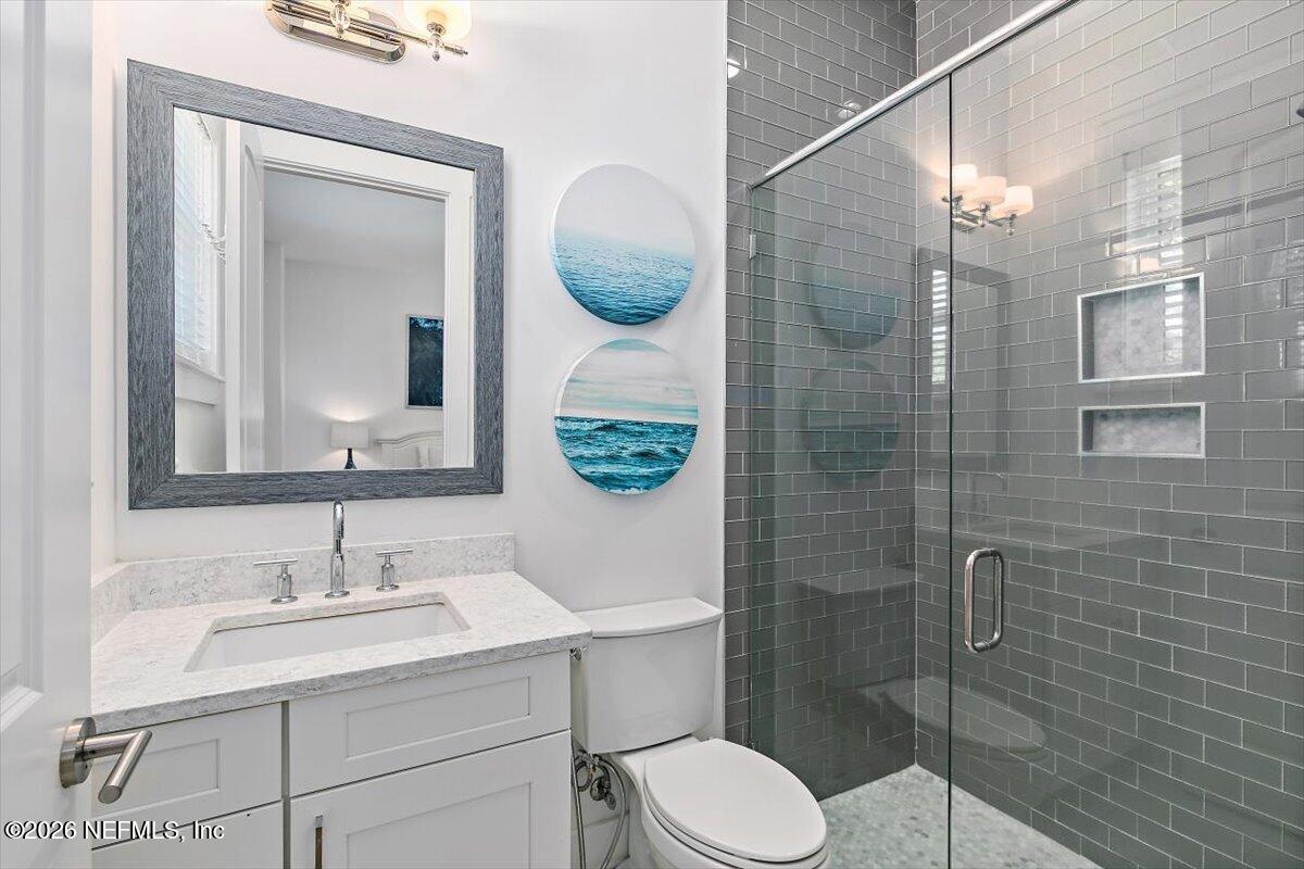 556 Timber Bridge Lane Atlantic Beach, FL 32233 - Photo 38 of 71 a bathroom with a sink toilet and shower