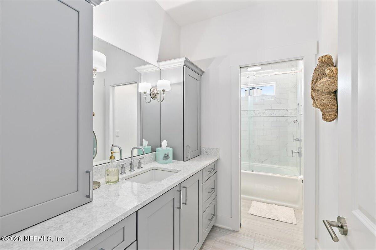 556 Timber Bridge Lane Atlantic Beach, FL 32233 - Photo 47 of 71 a bathroom with a double vanity sink mirror and shower