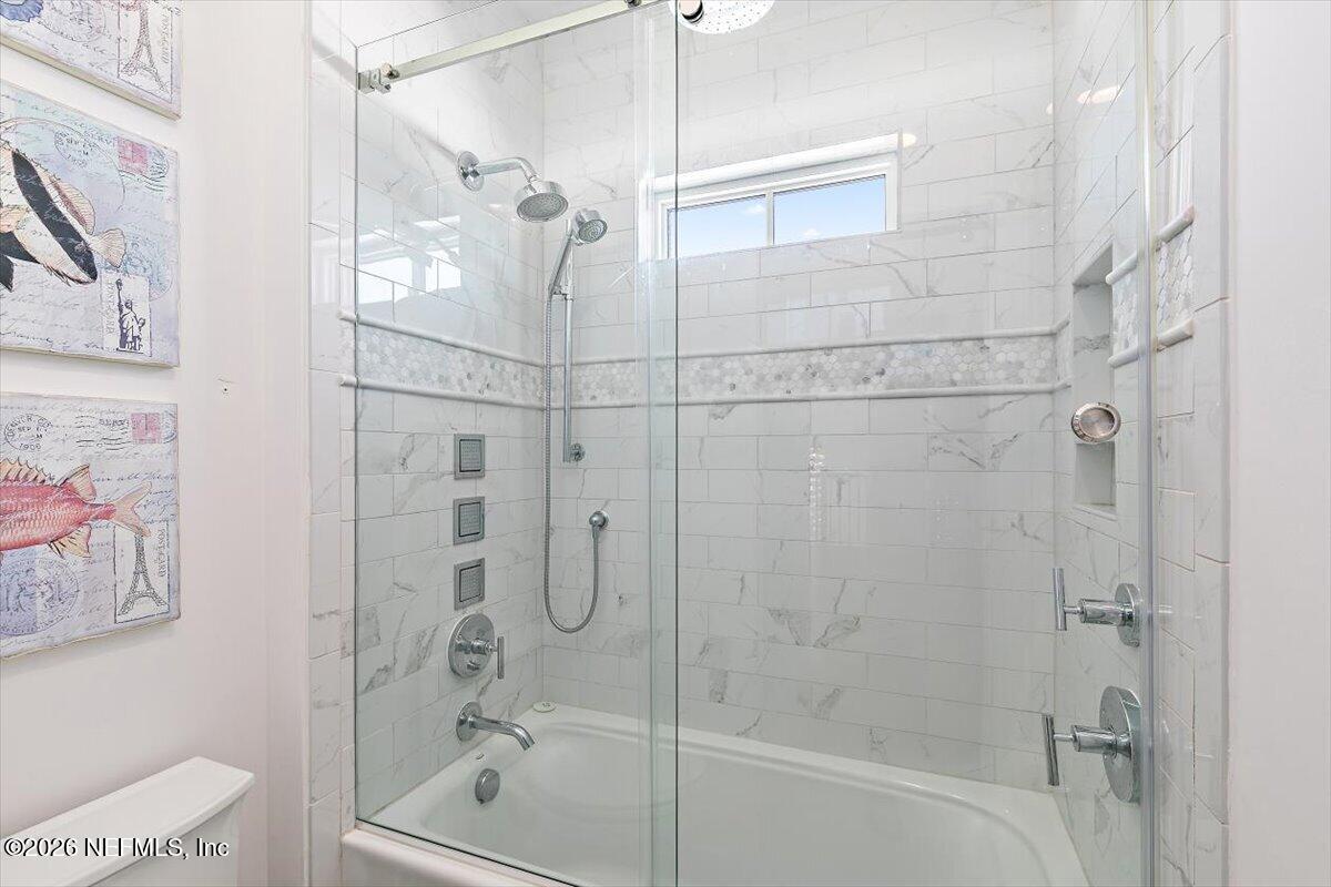 556 Timber Bridge Lane Atlantic Beach, FL 32233 - Photo 48 of 71 a bathroom with a bathtub and shower