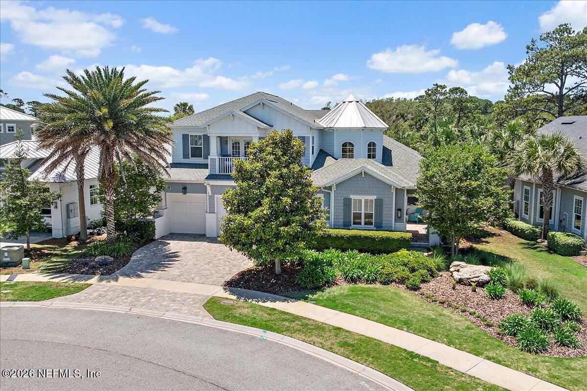 556 Timber Bridge Lane Atlantic Beach, FL 32233 - Photo 60 of 71 a front view of a house with a yard and potted plants
