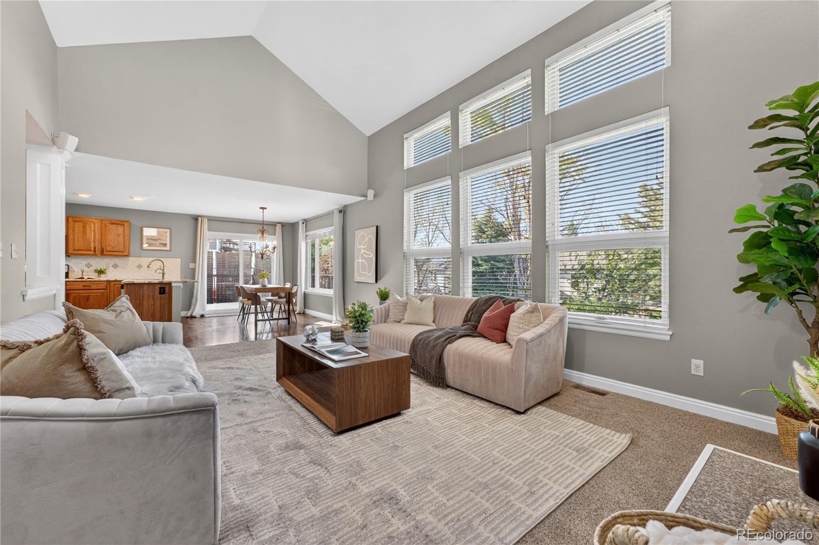 1774 Spring Water Place Highlands Ranch, CO 80129 - Photo 16 of 49 a living room with furniture and a large window