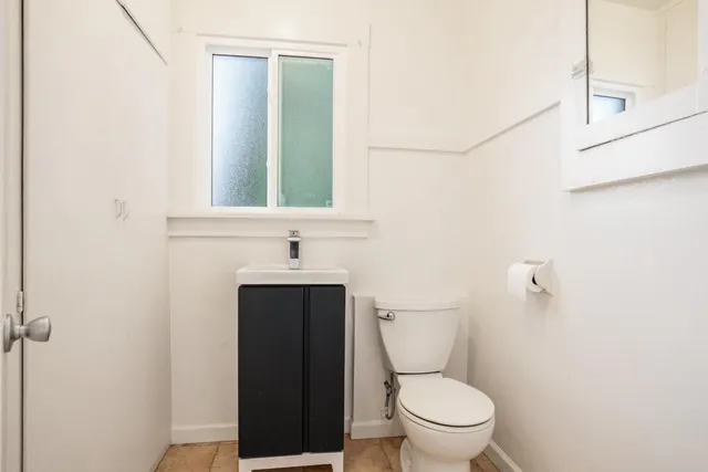 a bathroom with a toilet and a sink