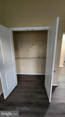 an empty room with wooden floor