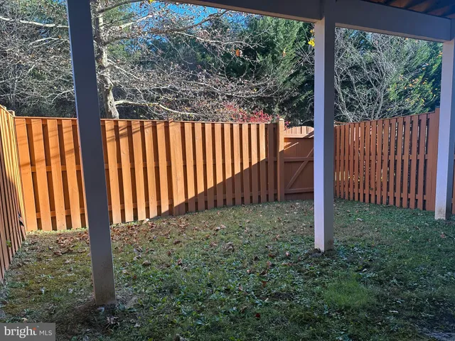 a view of a porch with a small yard