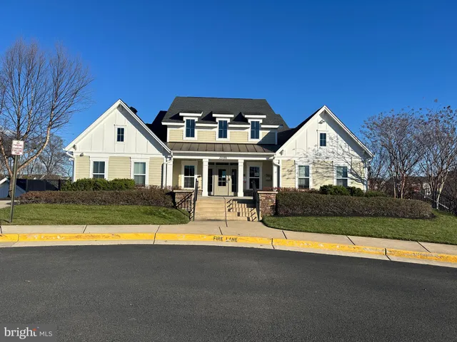 a front view of house with yard and swimming pool