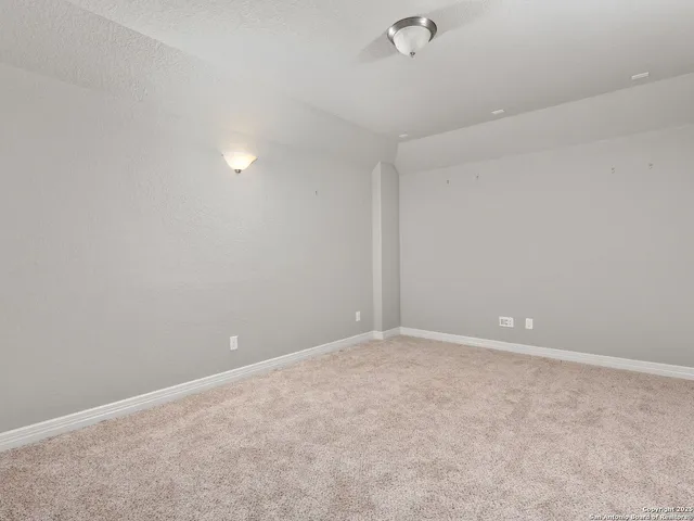 a view of a hallway with a window and stairs