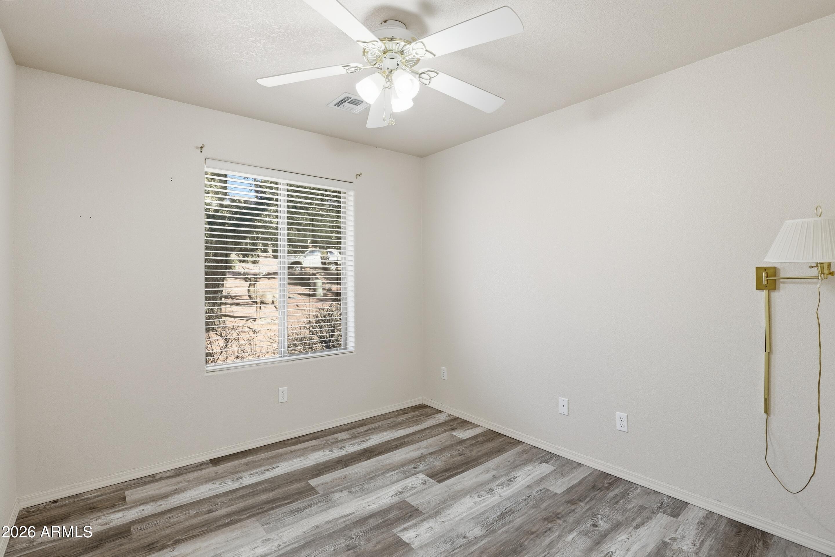 913 Landmark Trail Payson, AZ 85541 - Photo 22 of 47 a view of a livingroom with a window and a ceiling fan