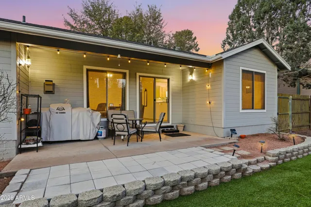 a front view of house with a garden