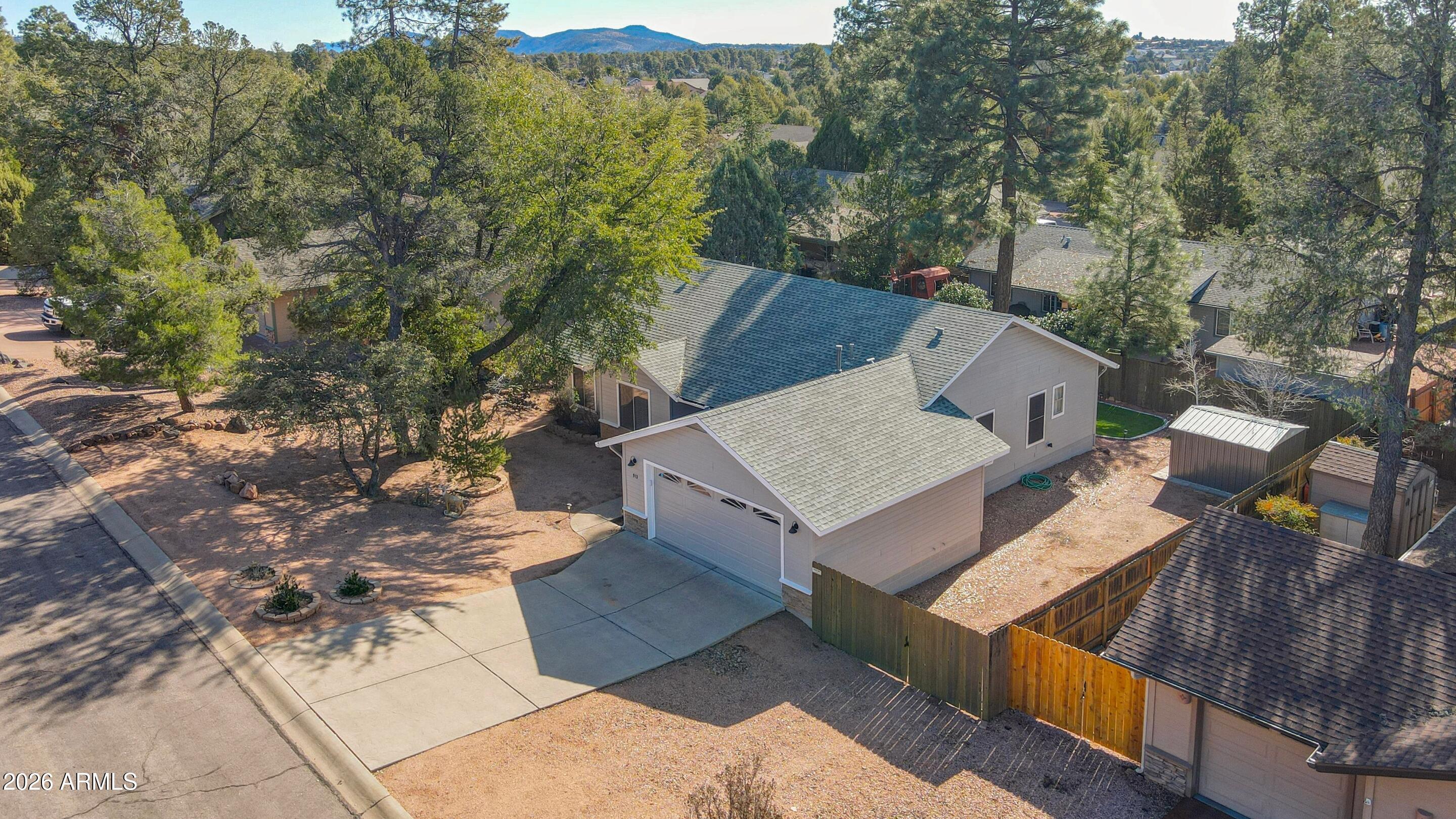 913 Landmark Trail Payson, AZ 85541 - Photo 40 of 47 an aerial view of a house with large trees