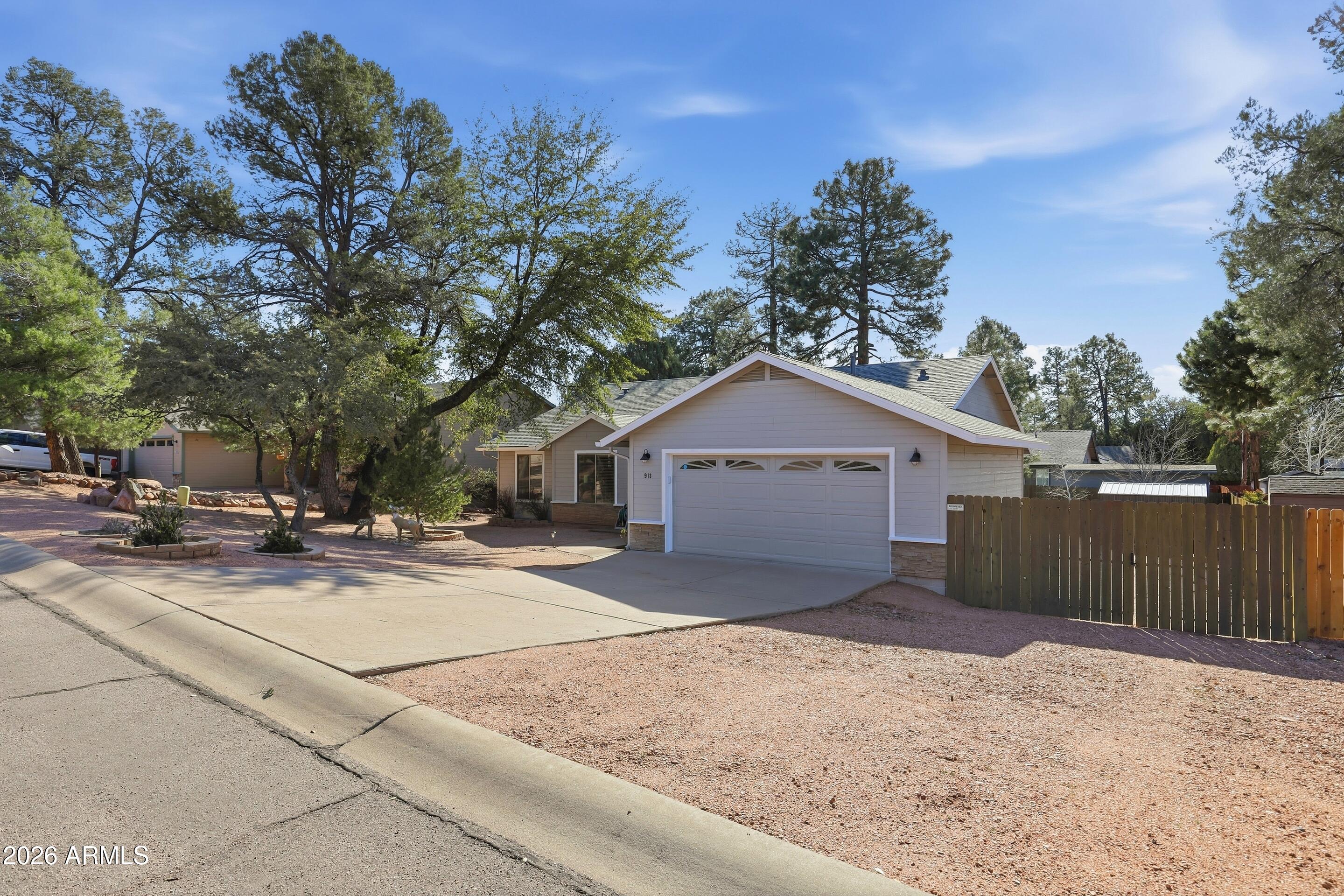 913 Landmark Trail Payson, AZ 85541 - Photo 42 of 47 a view of a house with a yard and large tree