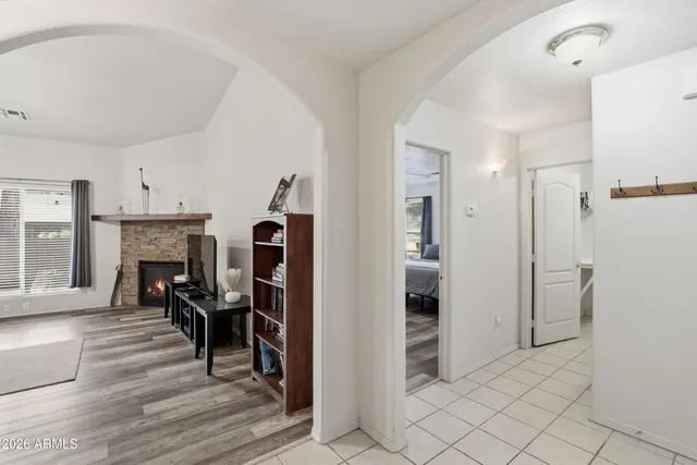 a view of a livingroom with a fireplace and furniture