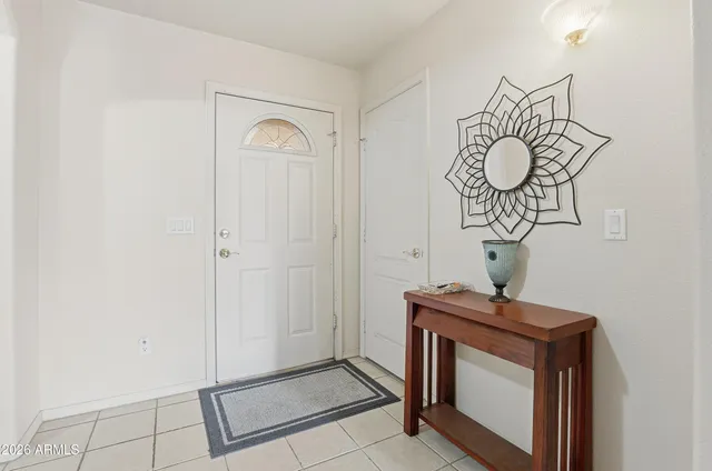 a view of an entryway with a mirror