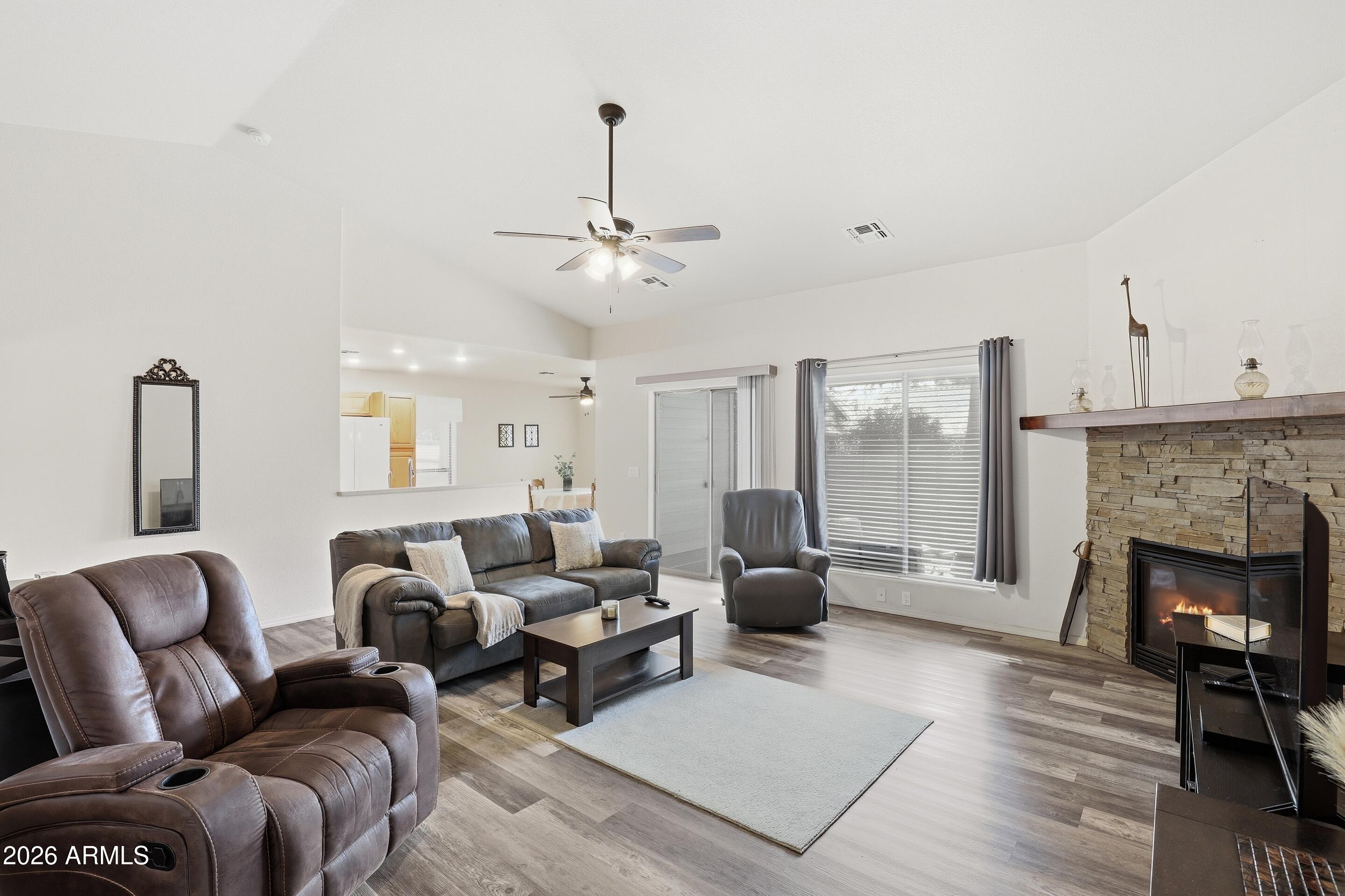 913 Landmark Trail Payson, AZ 85541 - Photo 7 of 47 a living room with furniture and a fireplace