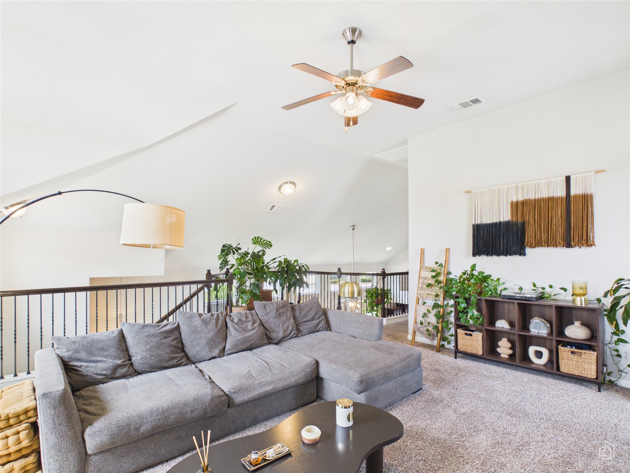 9310 Tanager Way Austin, TX 78748 - Photo 18 of 32 An inviting living space features high ceilings and soft carpet, ideal for comfortable gatherings.