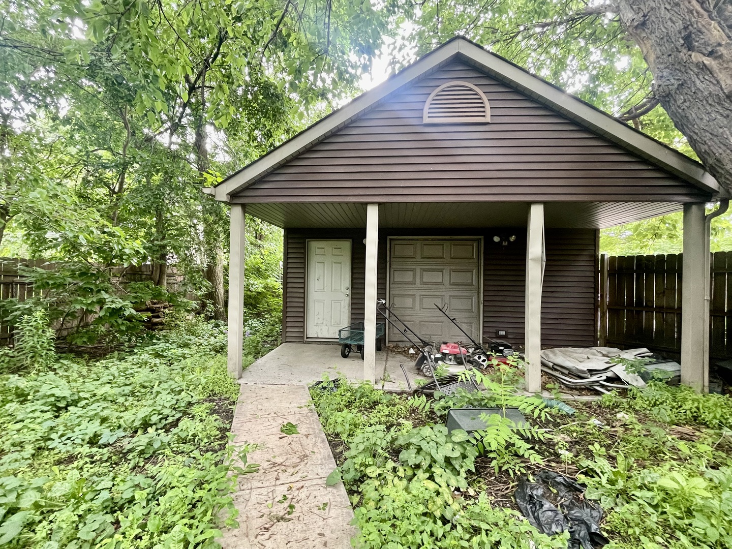 7916 South Constance Avenue Chicago, IL 60617 - Photo 27 of 28 a front view of a house with garden