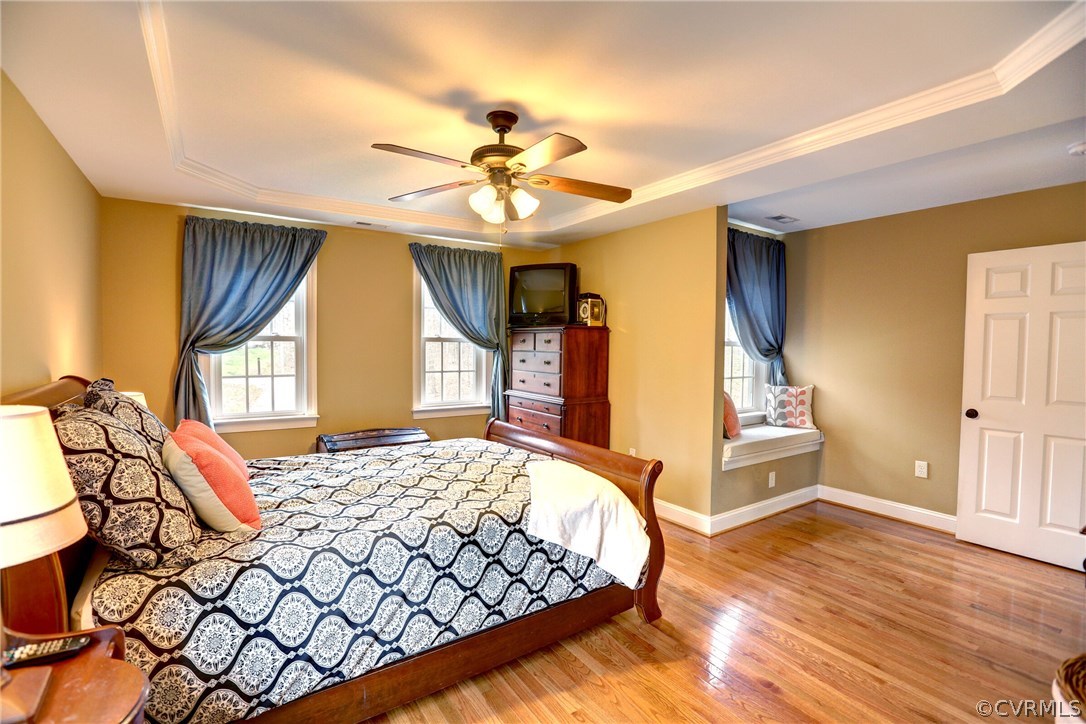 4947 Shannon Road Kents Store, VA 23084 - Photo 13 of 24 a bedroom with a bed and a chandelier