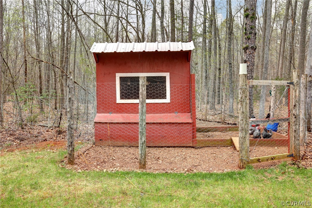 4947 Shannon Road Kents Store, VA 23084 - Photo 22 of 24 a front view of a house with garden