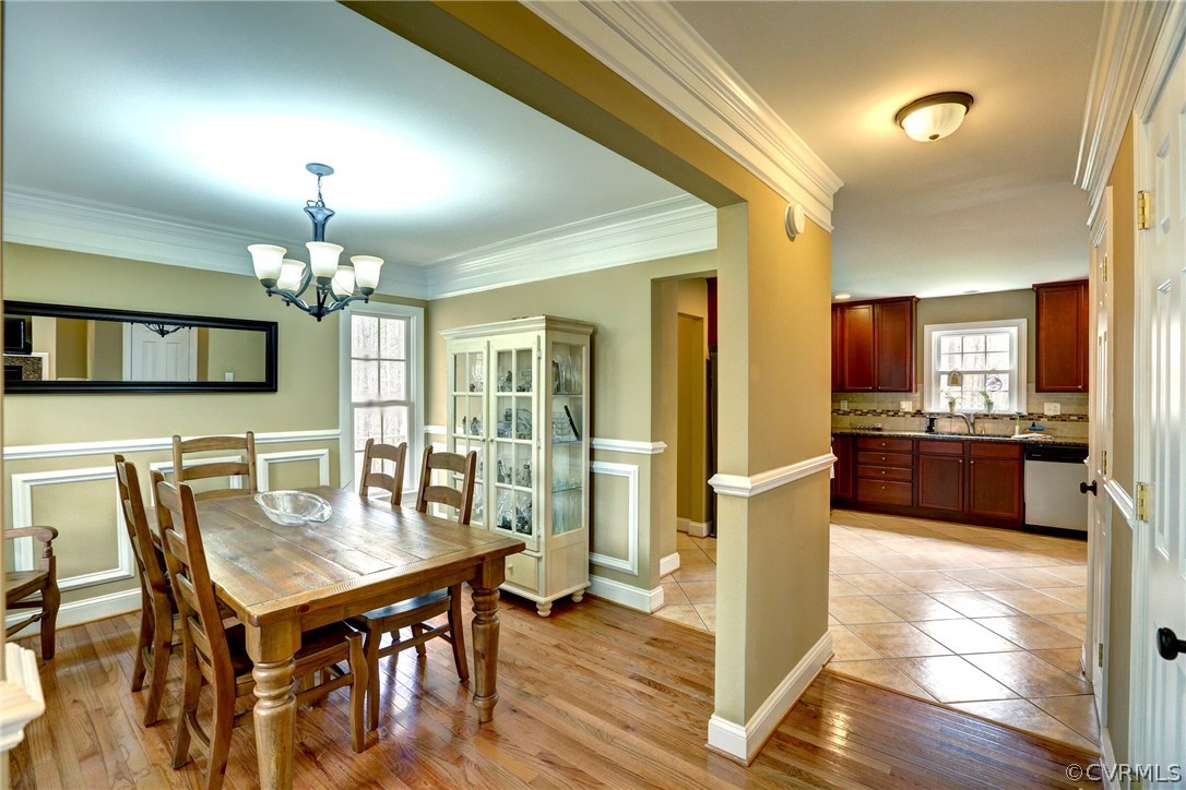 4947 Shannon Road Kents Store, VA 23084 - Photo 3 of 24 a view of a dining room with furniture and a chandelier