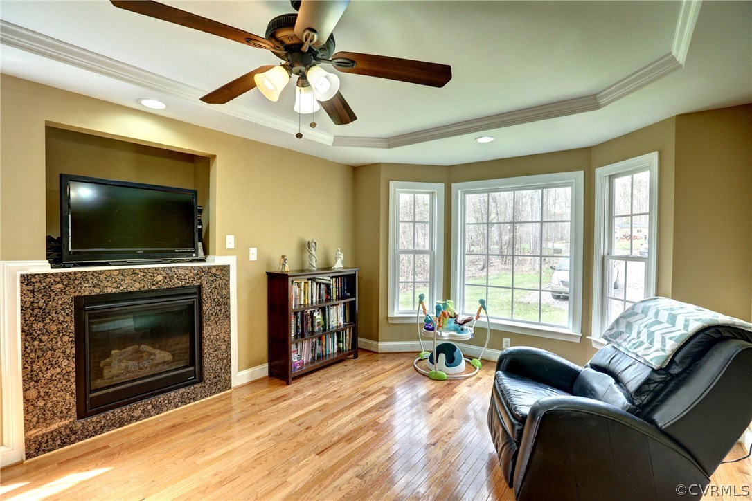 4947 Shannon Road Kents Store, VA 23084 - Photo 4 of 24 a living room with furniture a fireplace and a flat screen tv
