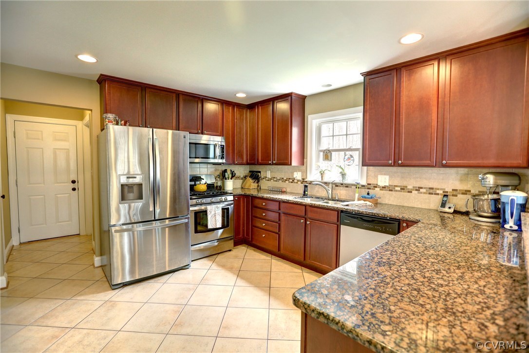4947 Shannon Road Kents Store, VA 23084 - Photo 7 of 24 a kitchen with stainless steel appliances granite countertop a refrigerator stove top oven and sink
