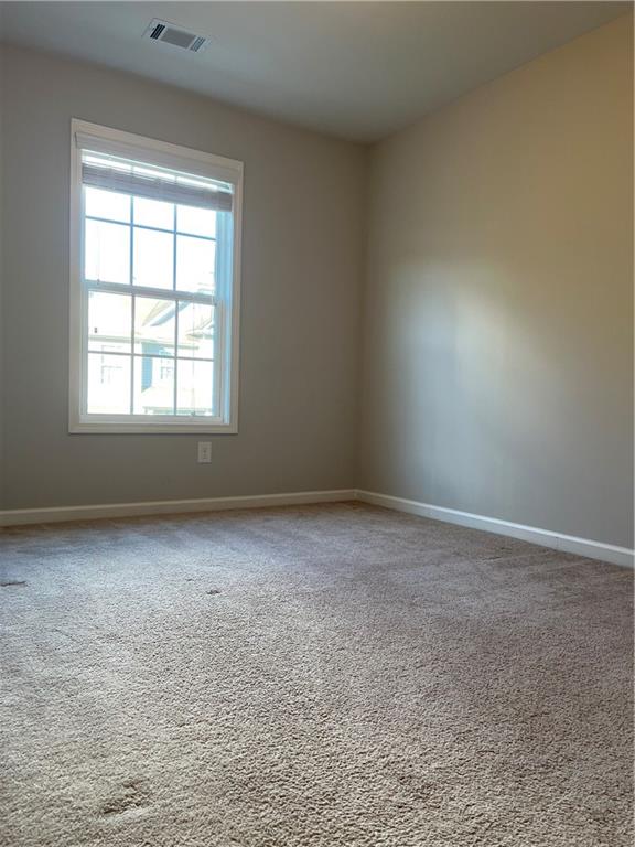 4720 Beacon Ridge Lane Flowery Branch, GA 30542 - Photo 16 of 20 an empty room with a window