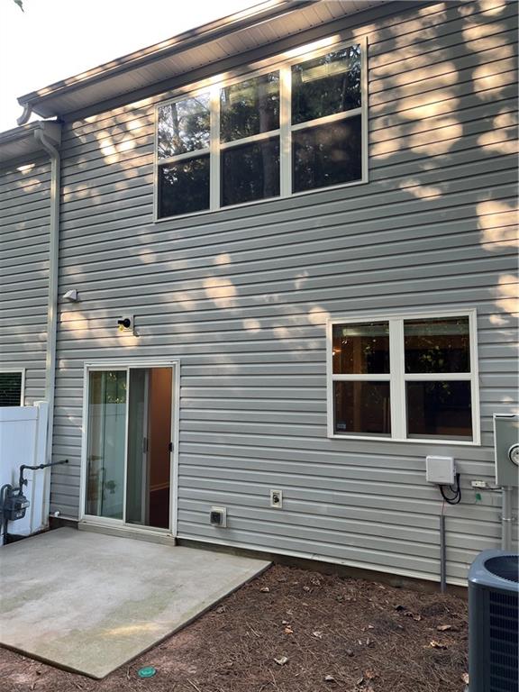 4720 Beacon Ridge Lane Flowery Branch, GA 30542 - Photo 18 of 20 a view of a house with a door and a yard