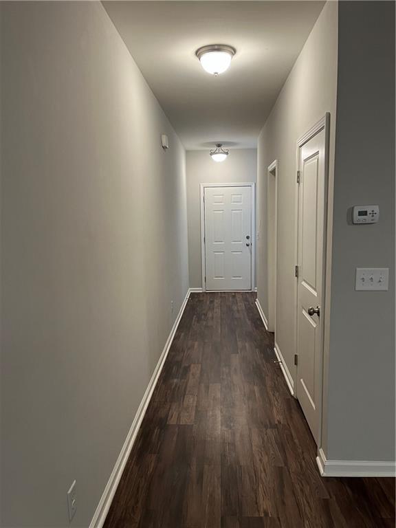 4720 Beacon Ridge Lane Flowery Branch, GA 30542 - Photo 7 of 20 a view of a hallway with wooden floor