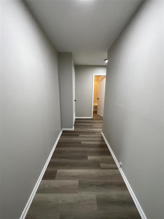 405 Beard Street Canton, TX 75103 - Photo 4 of 20 a view of a hallway with wooden floor and entryway