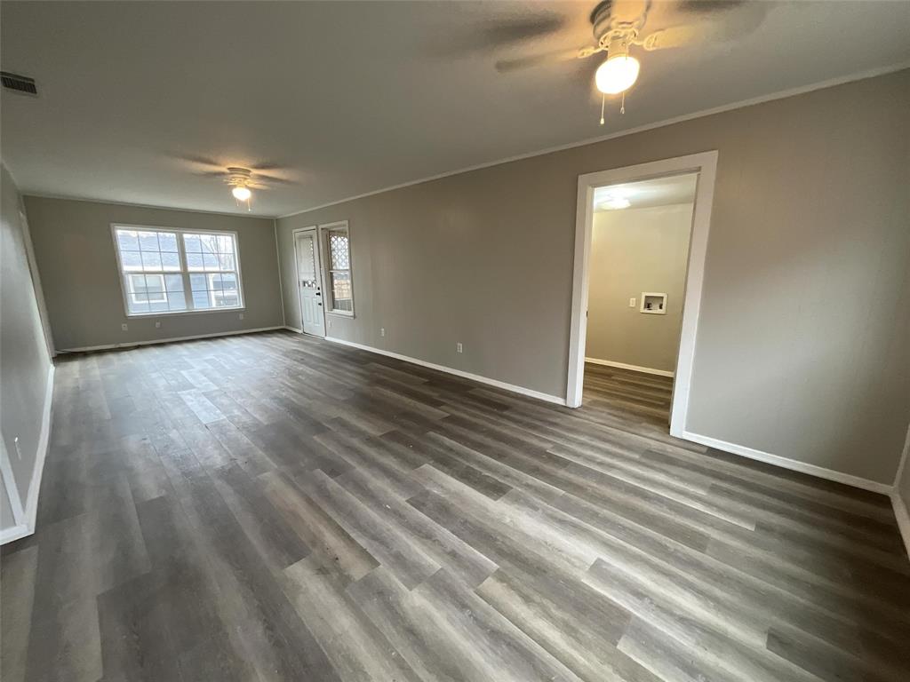 405 Beard Street Canton, TX 75103 - Photo 9 of 20 an empty room with wooden floor and windows