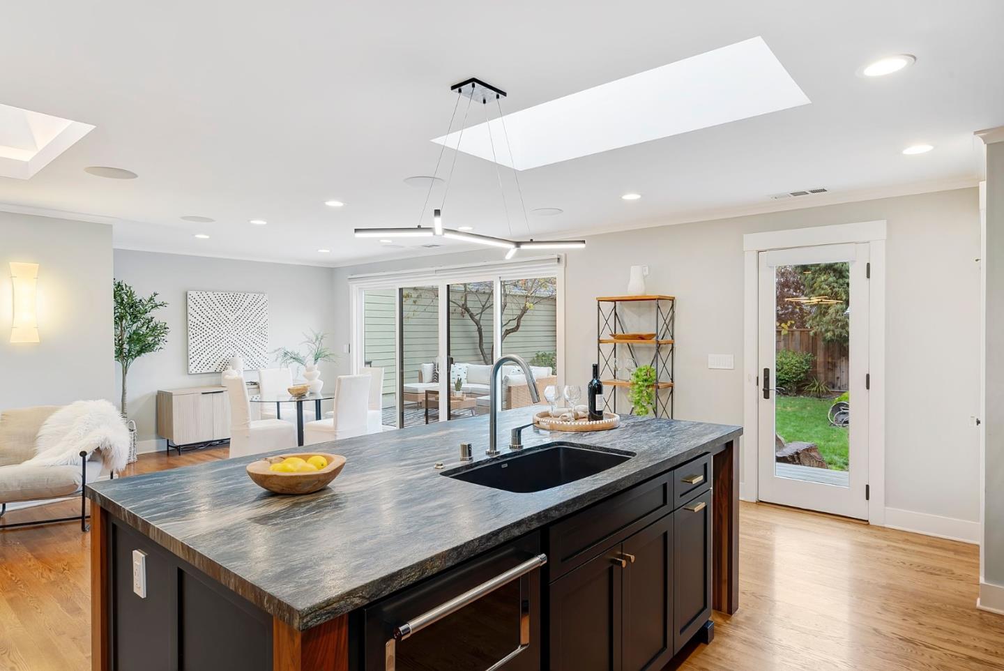 971 Pine Avenue San Jose, CA 95125 - Photo 13 of 36 a kitchen with stainless steel appliances granite countertop a sink a stove and a counter space