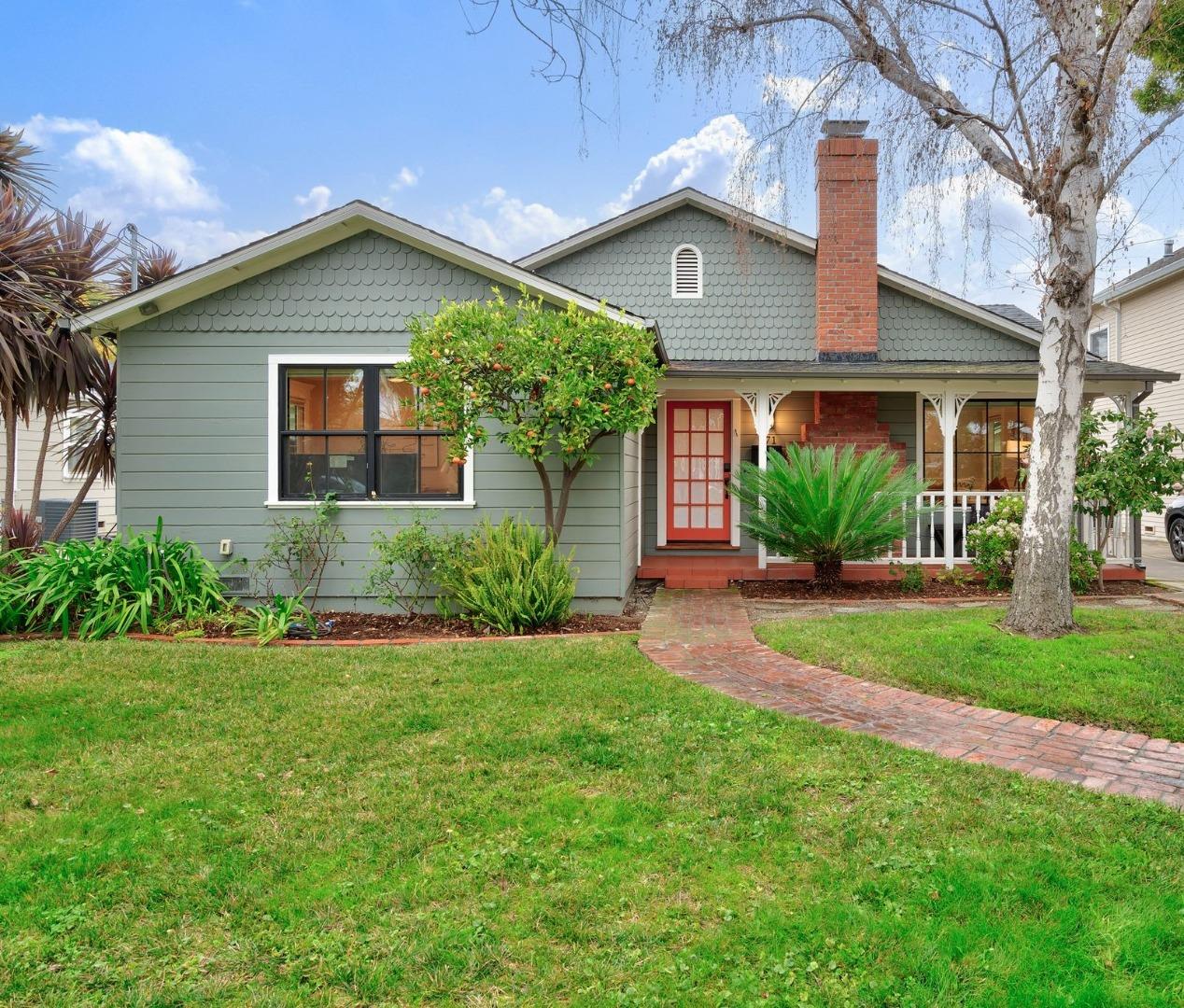 971 Pine Avenue San Jose, CA 95125 - Photo 2 of 36 a front view of a house with a yard and potted plants