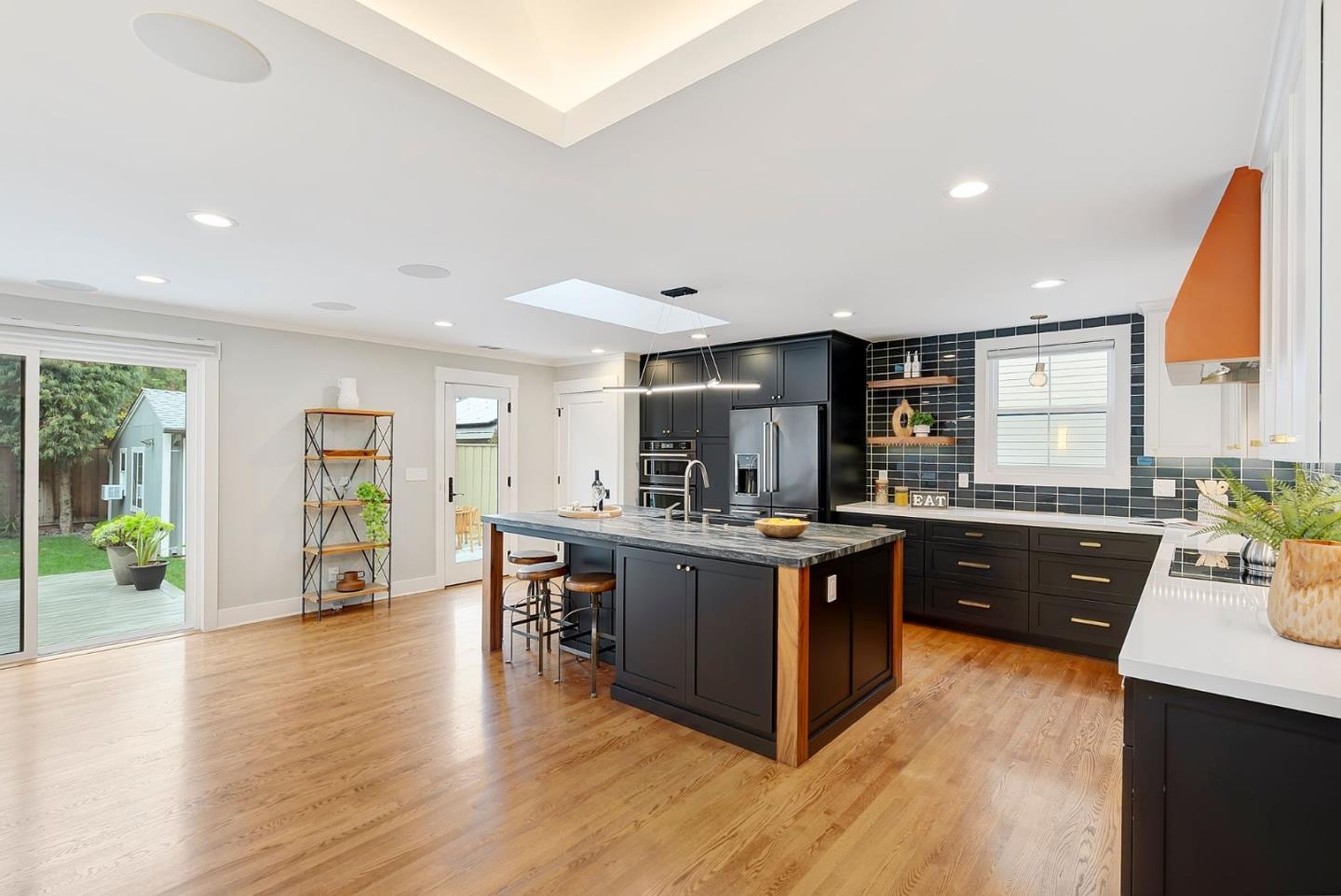 971 Pine Avenue San Jose, CA 95125 - Photo 9 of 36 a kitchen with stainless steel appliances granite countertop a sink and wooden floors