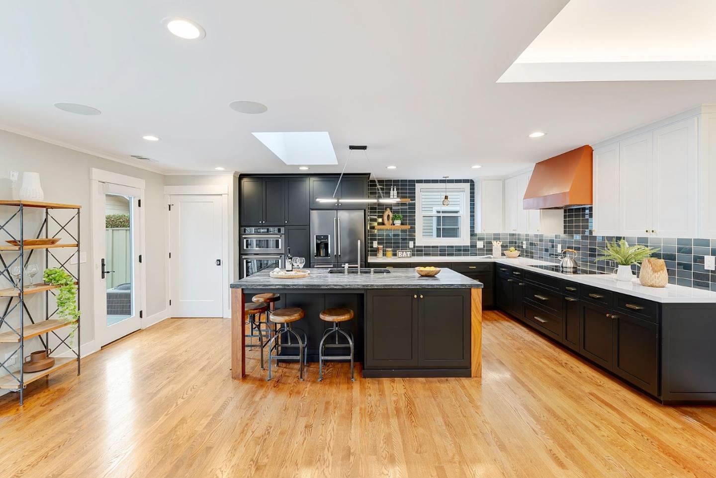 971 Pine Avenue San Jose, CA 95125 - Photo 10 of 36 a kitchen with stainless steel appliances granite countertop a sink and a wooden cabinets