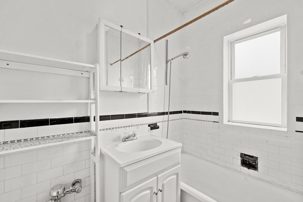 5 Haskell Street, Unit 31 Cambridge, MA 02140 - Photo 7 of 9 a view of bathroom with bathtub and window