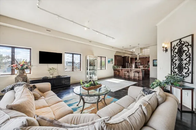 a kitchen with stainless steel appliances granite countertop a sink window and refrigerator