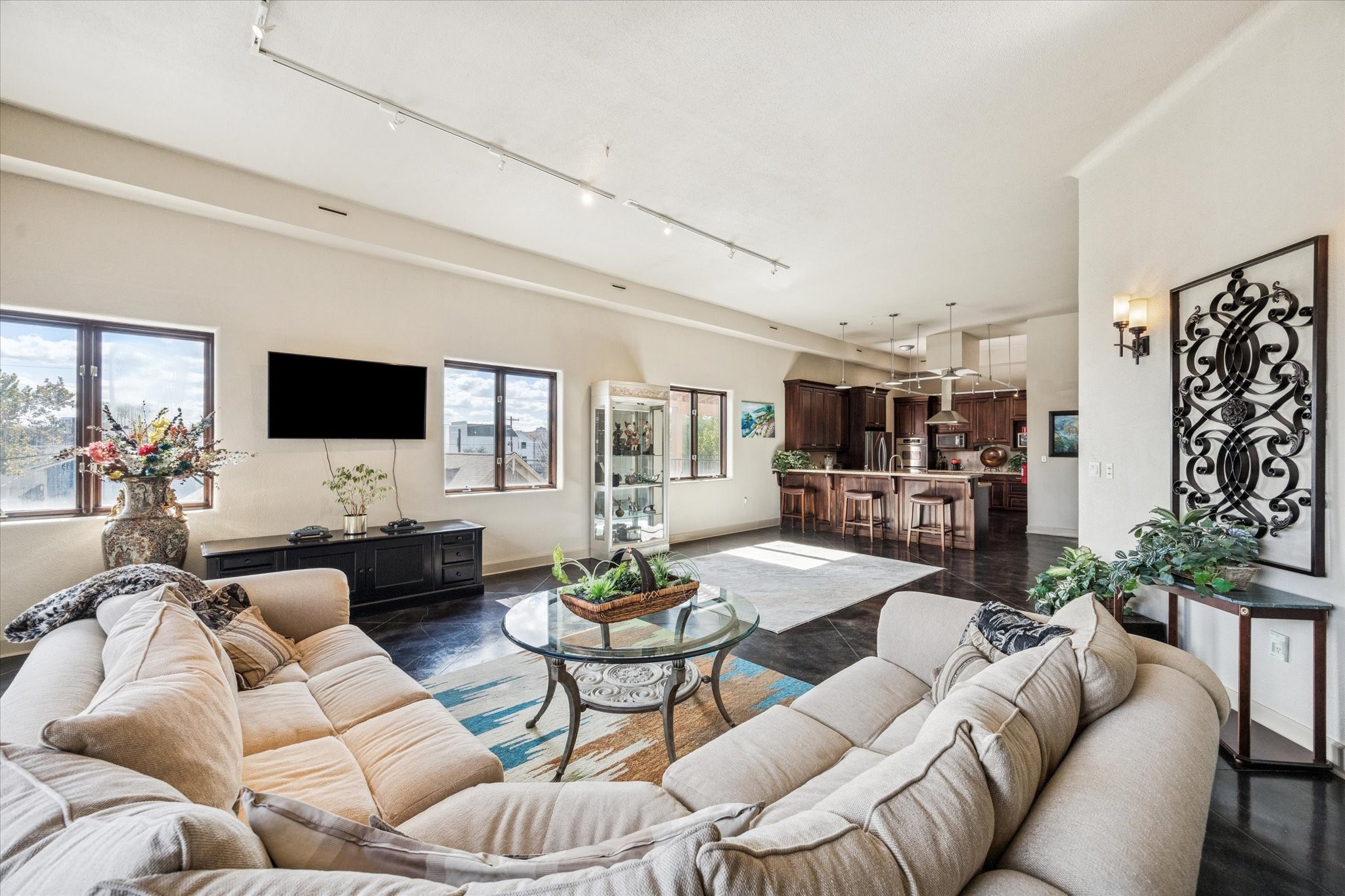 1919 Lubbock Street Houston, TX 77007 - Photo 14 of 36 a living room with furniture kitchen view and a flat screen tv