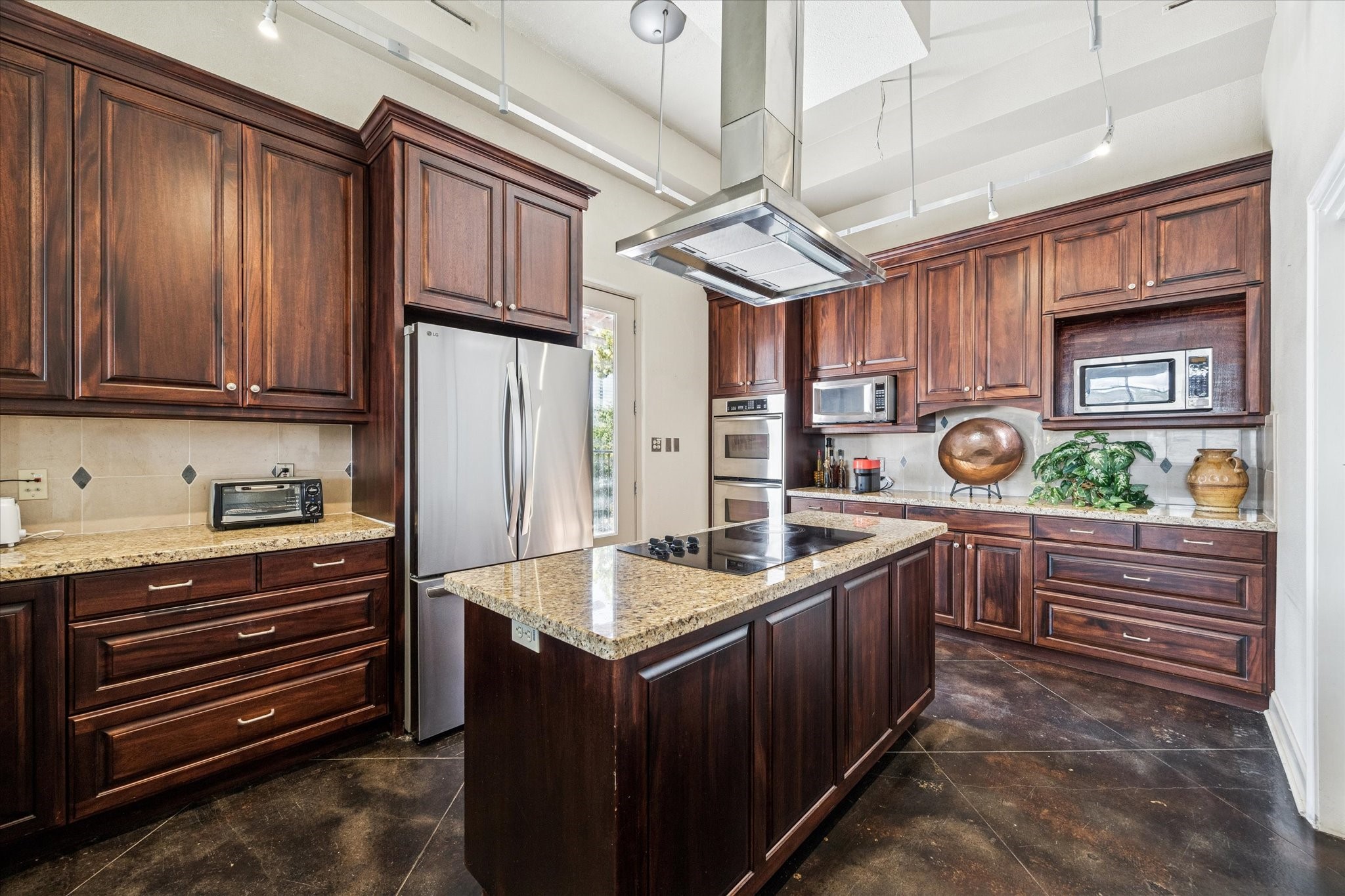 1919 Lubbock Street Houston, TX 77007 - Photo 16 of 36 a kitchen with stainless steel appliances granite countertop a sink and cabinets