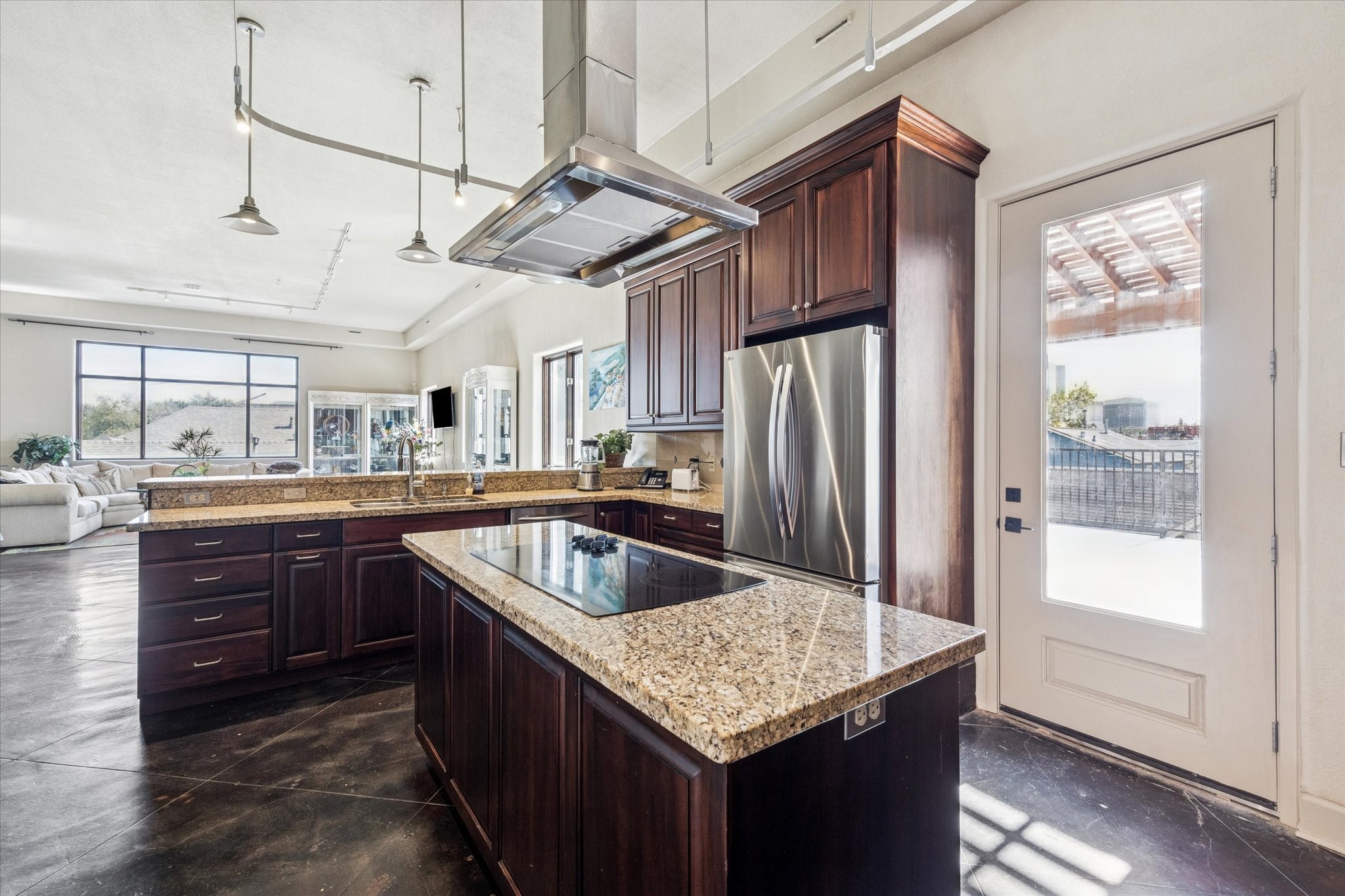 1919 Lubbock Street Houston, TX 77007 - Photo 17 of 36 a kitchen with stainless steel appliances granite countertop a sink window and refrigerator