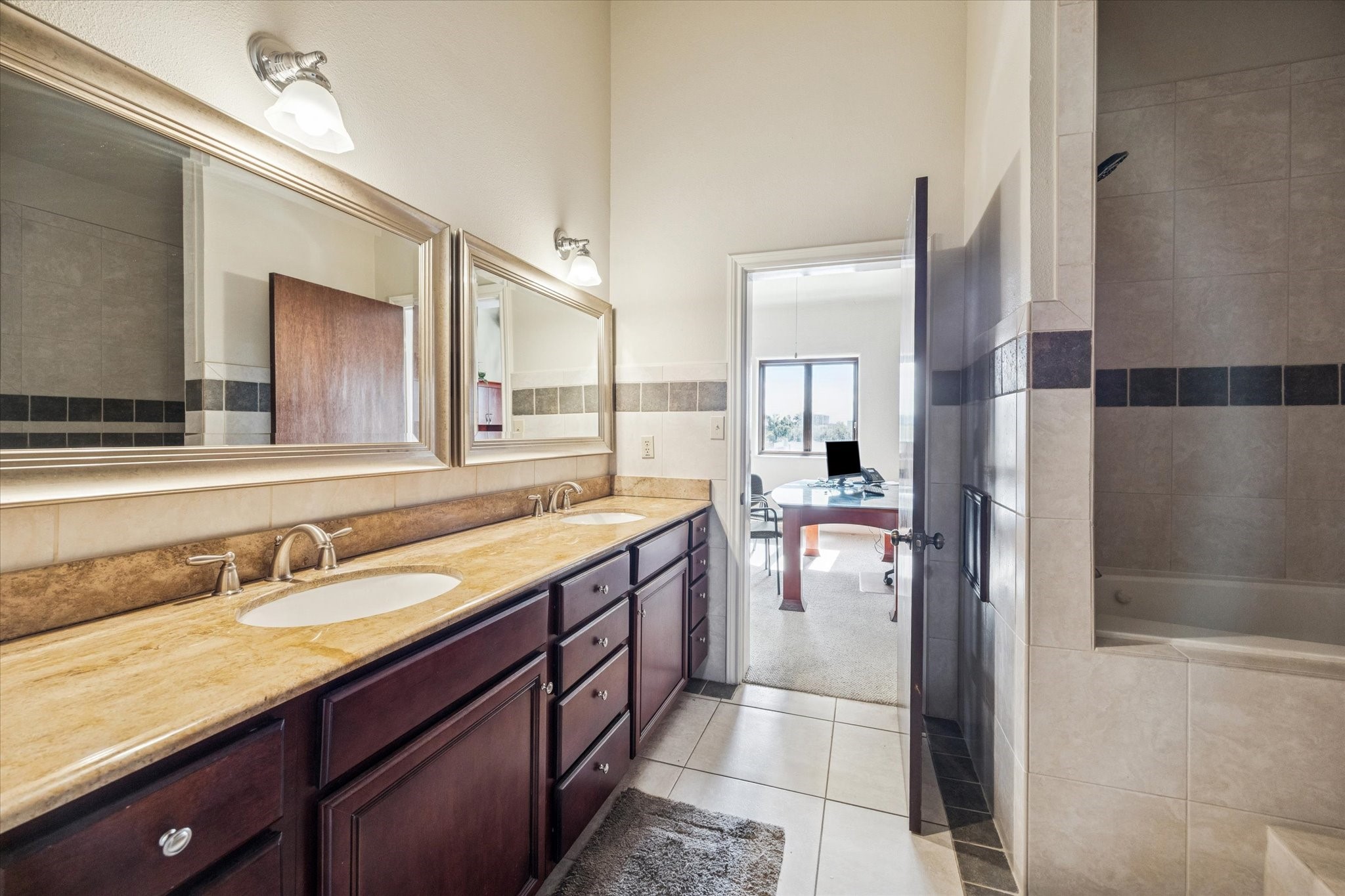 1919 Lubbock Street Houston, TX 77007 - Photo 24 of 36 a bathroom with a granite countertop sink mirror and double