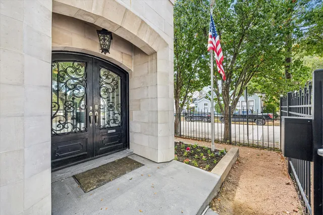 a living room with furniture kitchen view and a potted plant