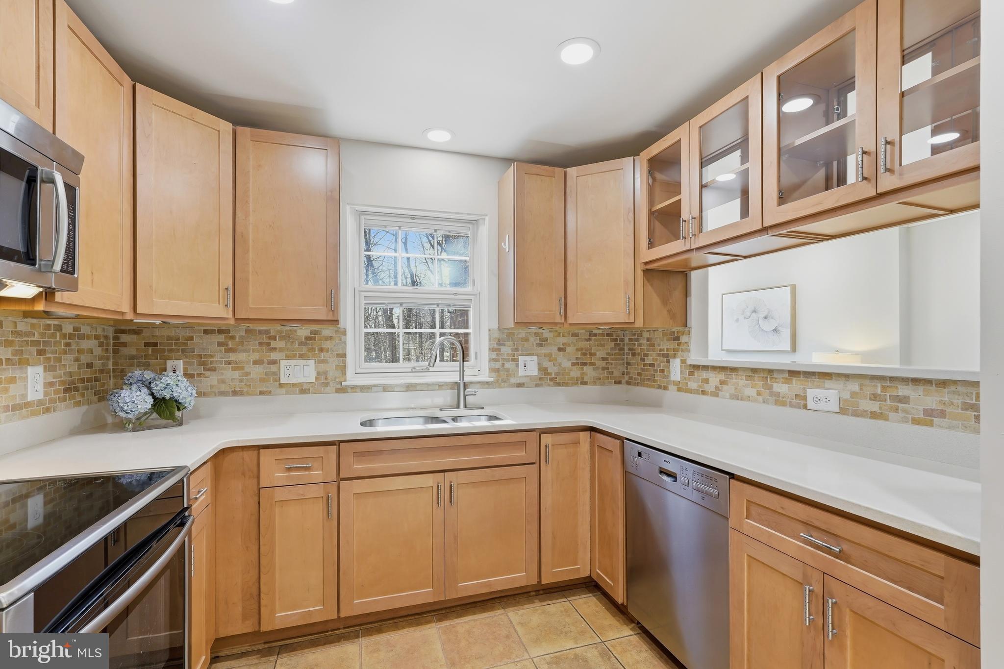 1472 Park Garden Lane Reston, VA 20194 - Photo 14 of 64 a kitchen with a sink stove and cabinets