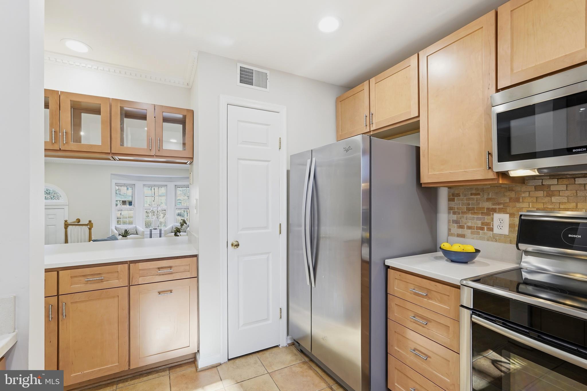 1472 Park Garden Lane Reston, VA 20194 - Photo 16 of 64 a kitchen with stainless steel appliances a refrigerator stove and sink