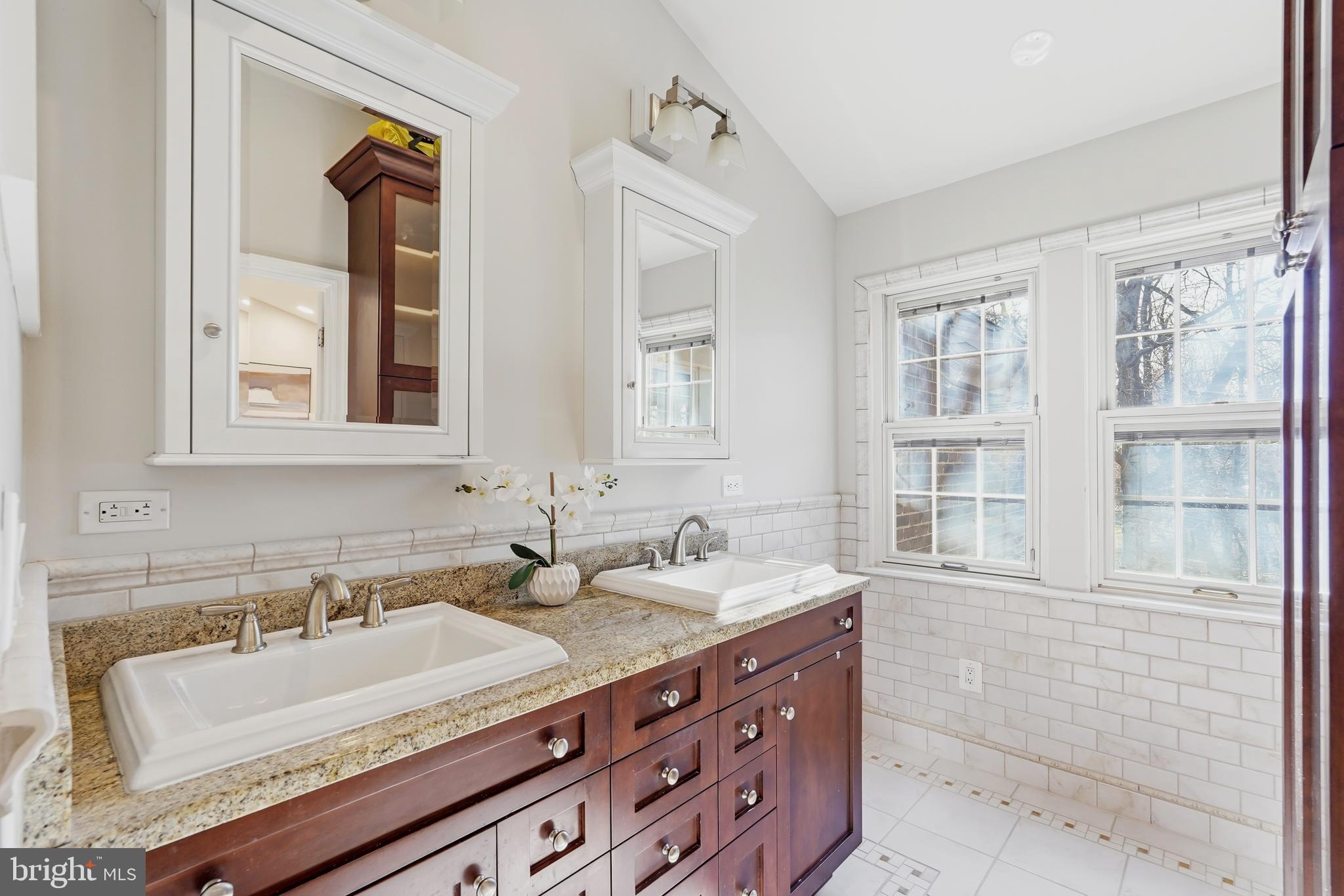 1472 Park Garden Lane Reston, VA 20194 - Photo 29 of 64 a bathroom with a granite countertop sink and a mirror