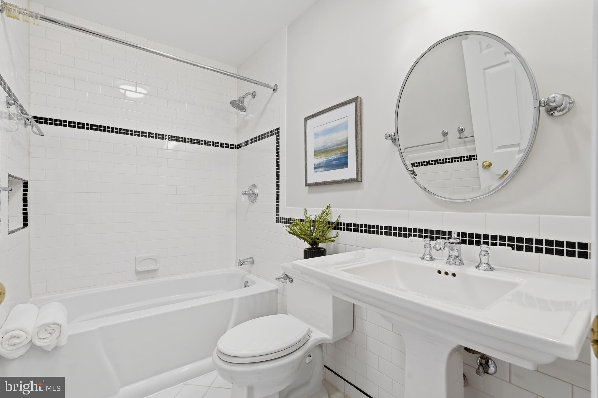 1472 Park Garden Lane Reston, VA 20194 - Photo 39 of 64 a bathroom with a sink a toilet and a mirror