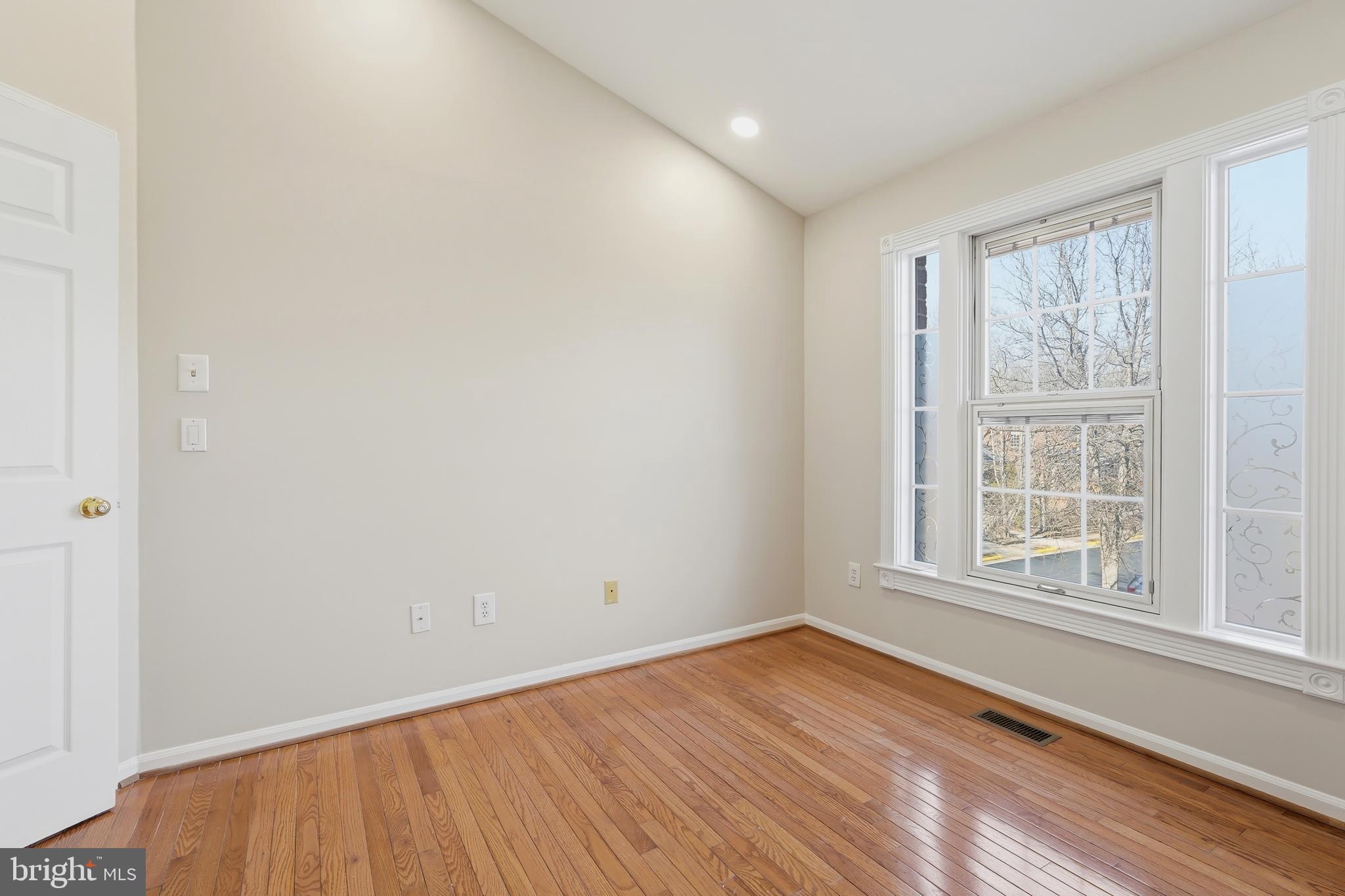 1472 Park Garden Lane Reston, VA 20194 - Photo 41 of 64 an empty room with wooden floor and windows