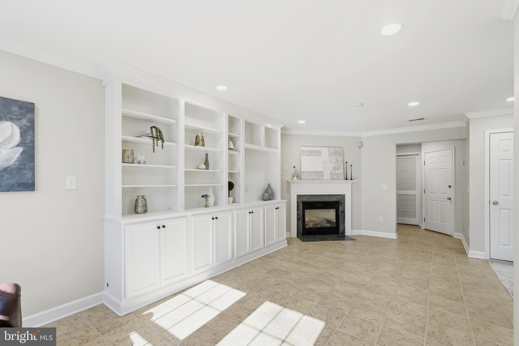 1472 Park Garden Lane Reston, VA 20194 - Photo 49 of 64 a view of a livingroom with an empty space and a fireplace