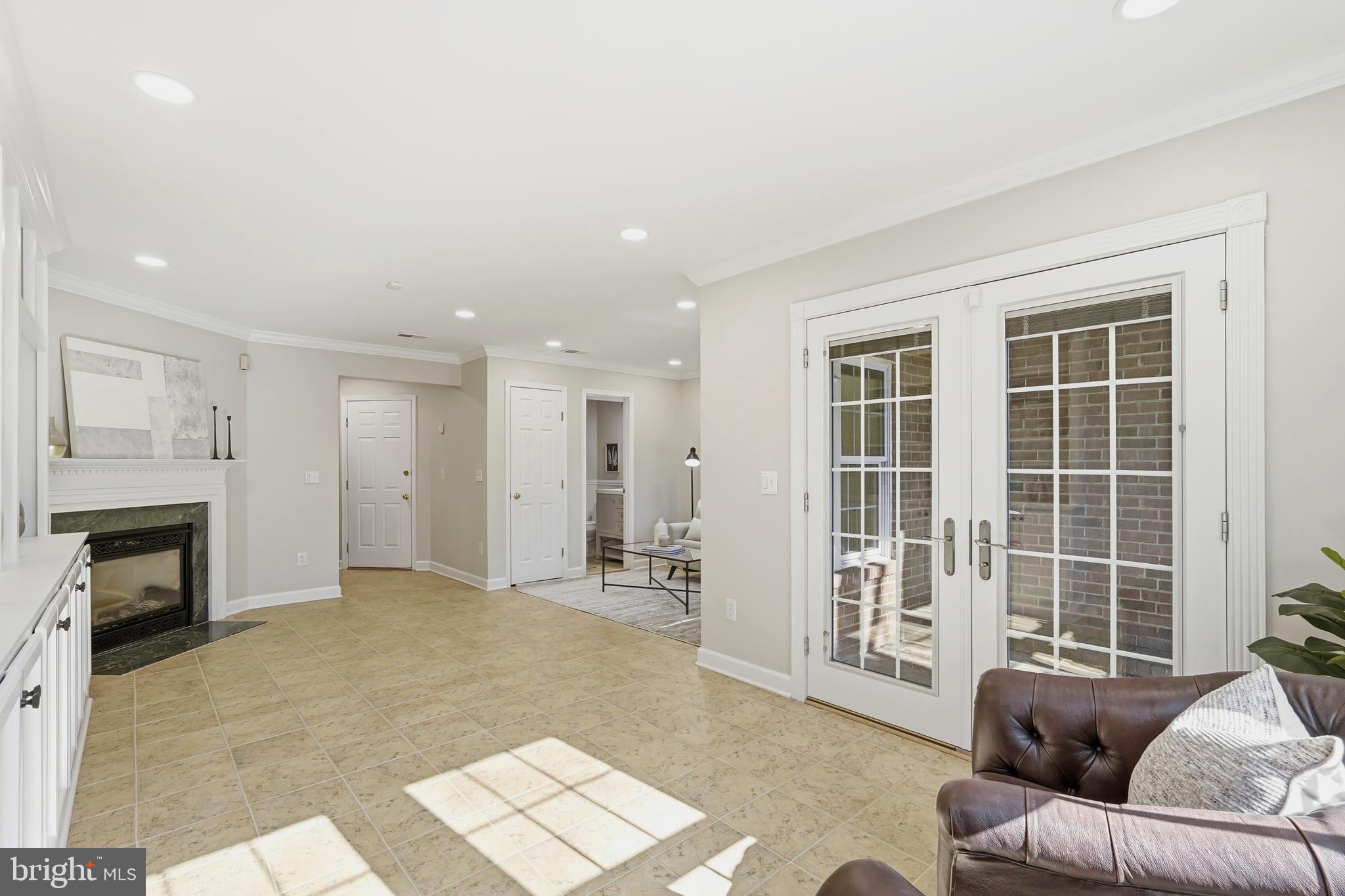 1472 Park Garden Lane Reston, VA 20194 - Photo 50 of 64 a living room with furniture and a fireplace