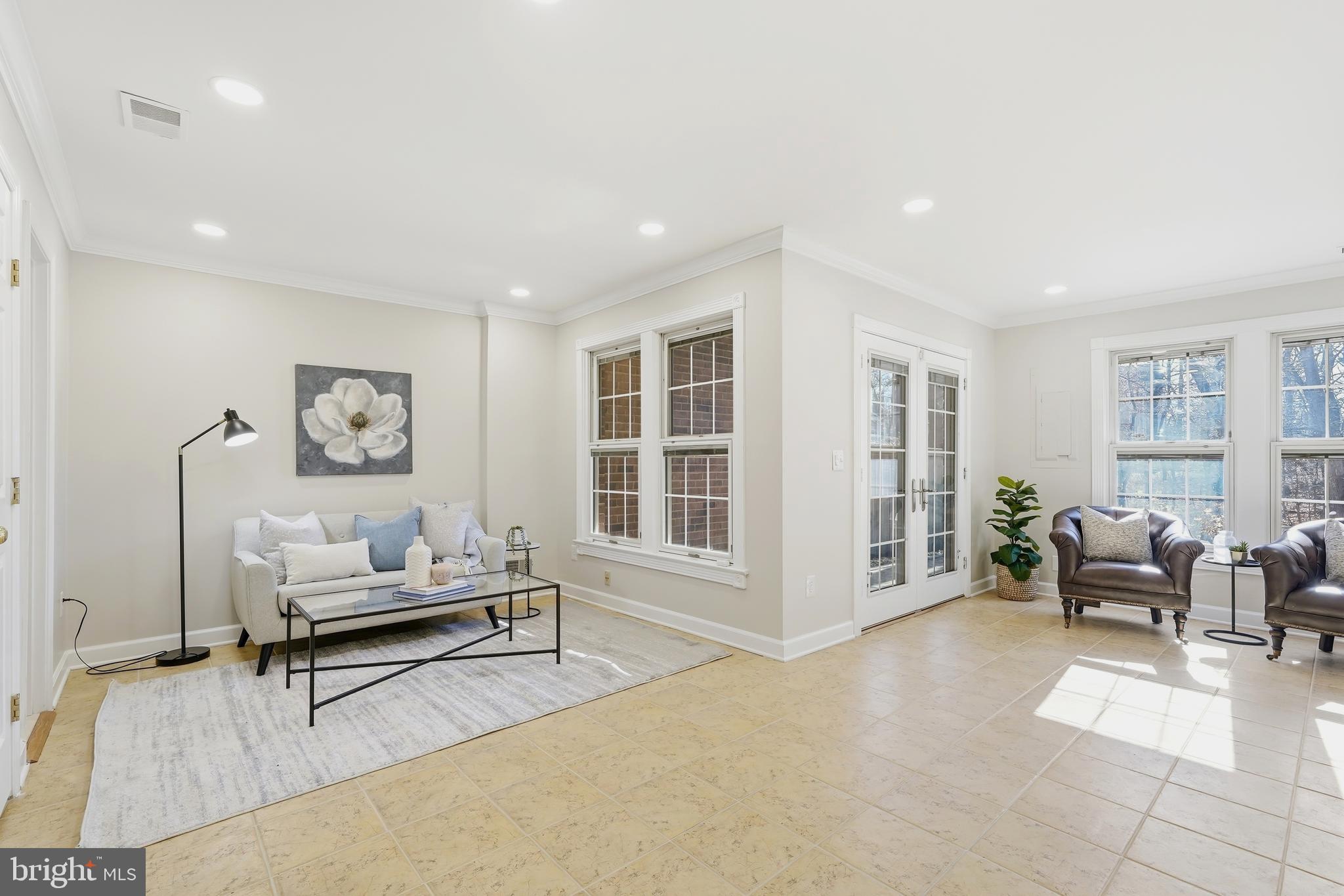 1472 Park Garden Lane Reston, VA 20194 - Photo 51 of 64 a living room with furniture and large windows