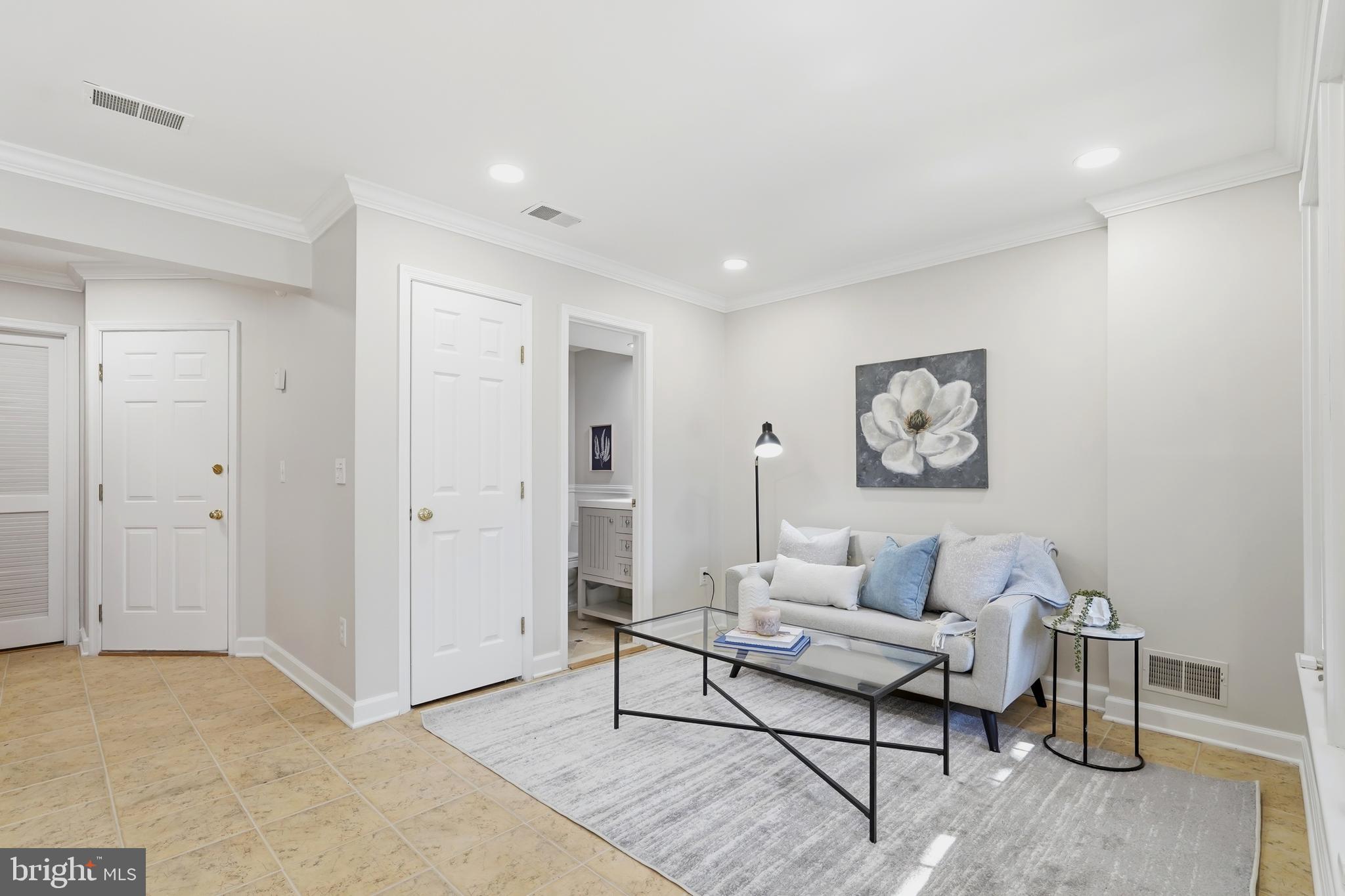 1472 Park Garden Lane Reston, VA 20194 - Photo 52 of 64 a living room with furniture and a rug